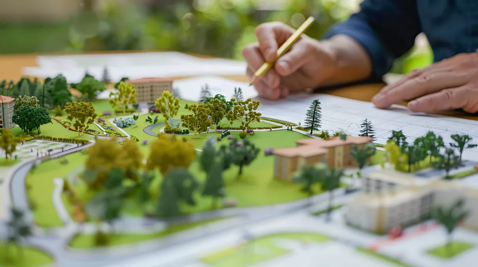 man-is-drawing-model-model-house